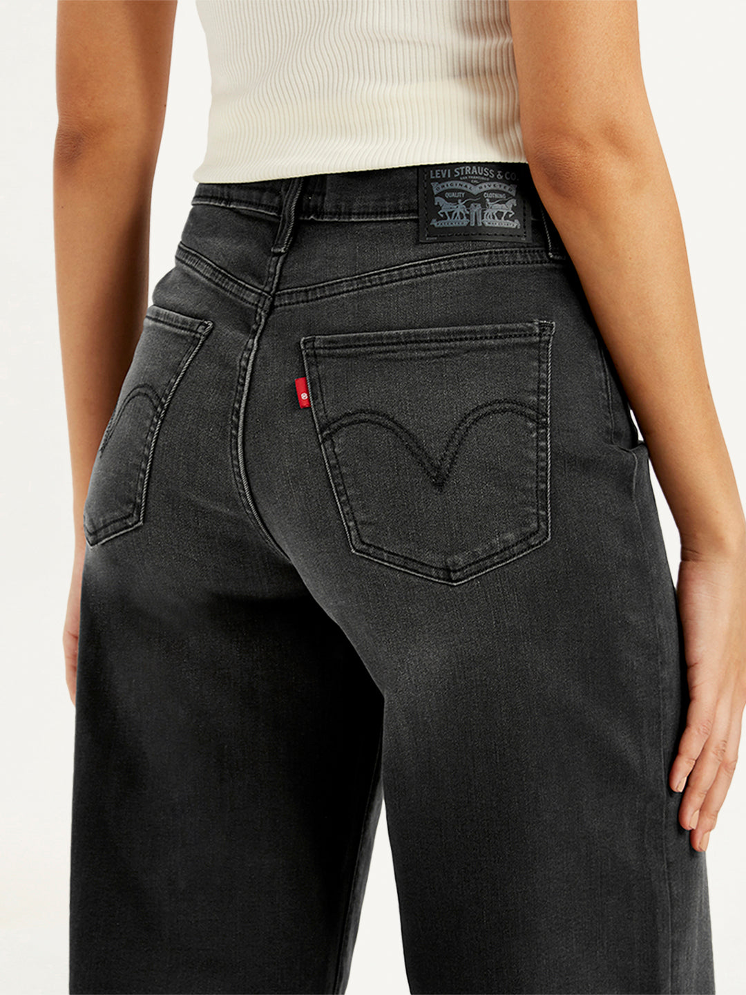 Levi's women's charcoal grey high-rise wide-leg jeans with mile-high fit, showcasing the relaxed, flowing leg design and high waist.
