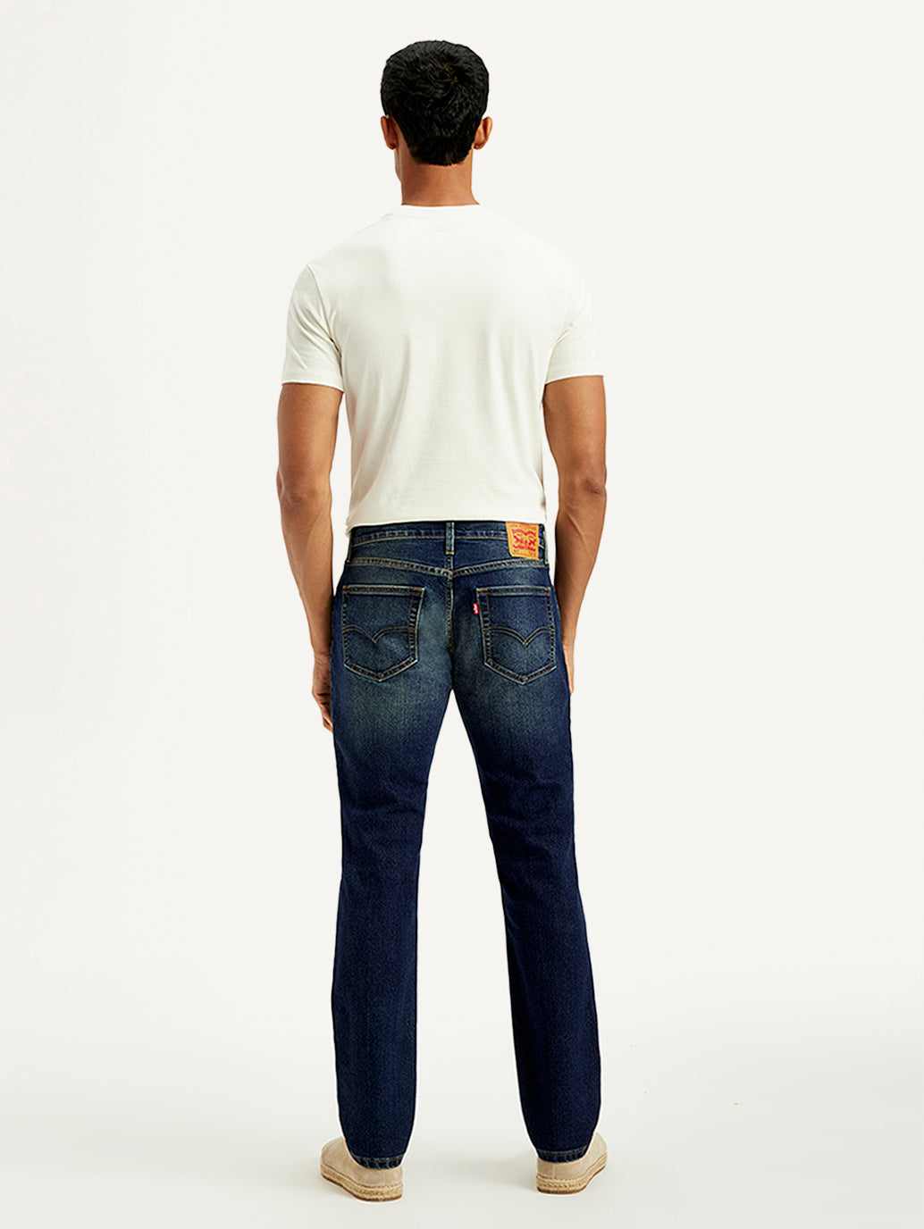 Levi's men's tinted 511 blue slim fit mid-rise jeans, showcasing the fit and denim texture.