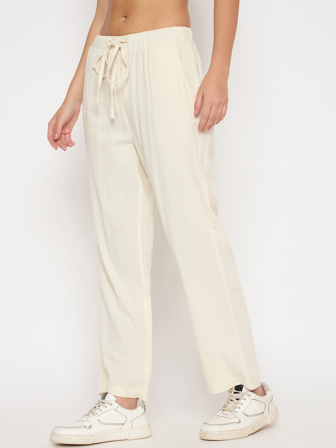 Cream Madame Ladies Western Pants M5S27027 041 with a relaxed fit, showcased on a hanger with a plain background.