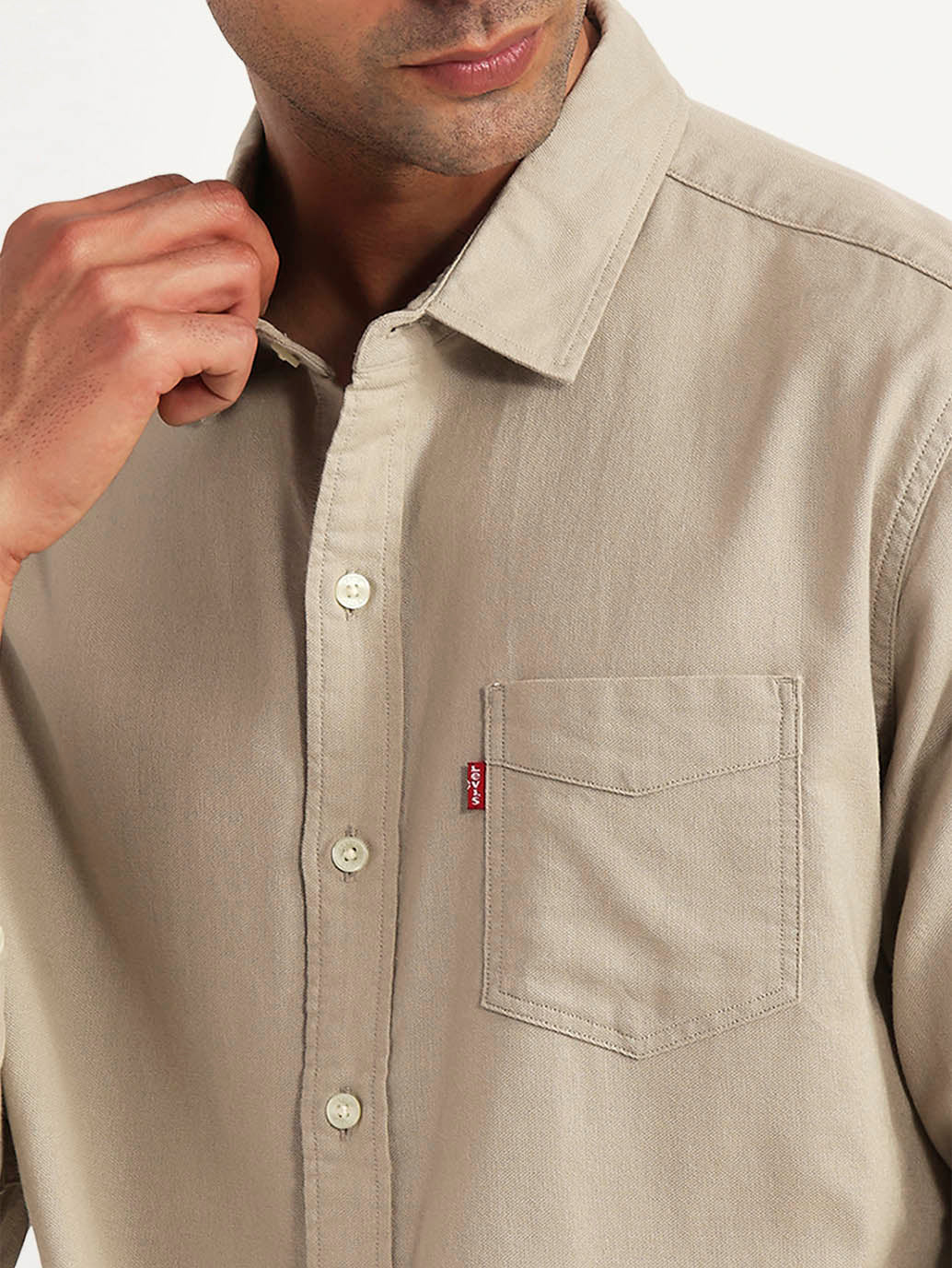 Levis men's casual shirt with detailed fabric texture and button closure, displayed on a flat surface.