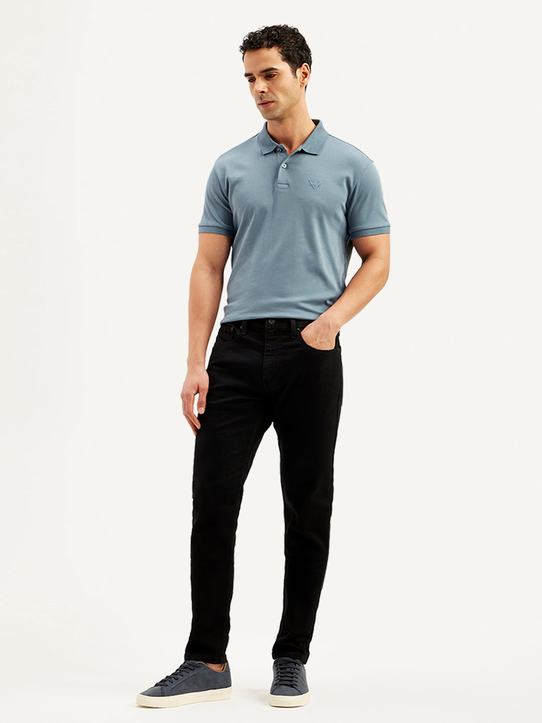 Levis men's jeans 36087-1021 in classic blue denim, shown on a model with a relaxed fit and visible stitching details.