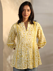 Yellow printed cotton A-line short Kurti for ladies by Libas, featuring a western style with floral design.