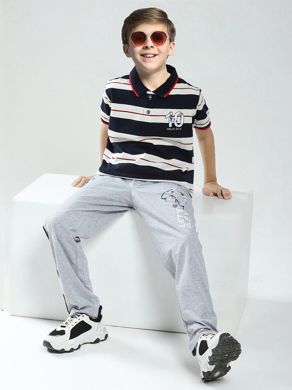 Monte Carlo boys' sportswear pajama set with colorful patterns, featuring a long-sleeve top and matching pants.