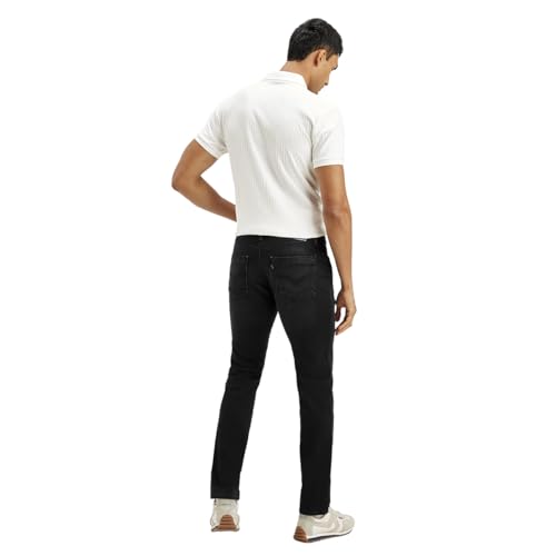 Black Levi's men's slim jeans displayed on a hanger with a classic five-pocket design and subtle stitching details.