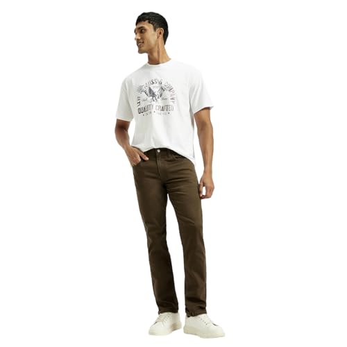 Levi's men's brown 511 slim fit mid-rise jeans displayed, showing the classic five-pocket design and tapered leg fit.