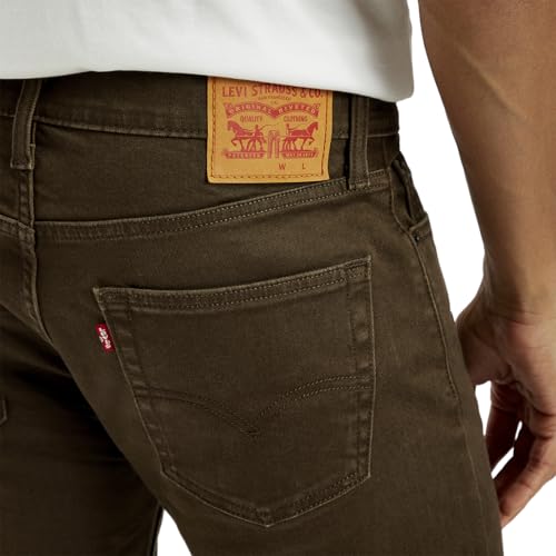 Levi's men's brown 511 slim fit mid-rise jeans with classic five-pocket design and belt loops, displayed on a hanger.