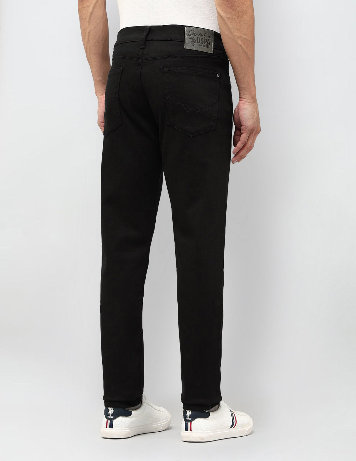 U.S. Polo men's jeans in classic blue denim with a slim fit, front pockets, and belt loops.