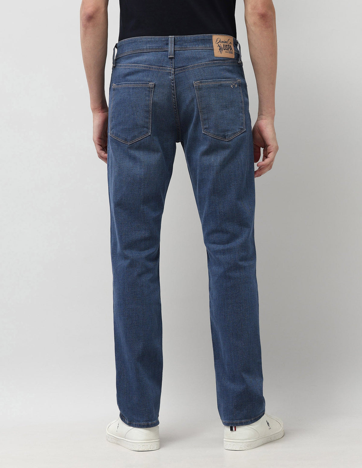 U.S. Polo men's jeans in classic blue denim, featuring a slim fit design with front and back pockets, casual style.