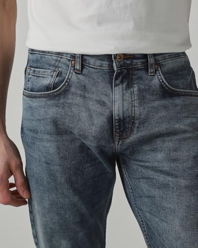 Mufti men's straight-leg jeans in medium wash faded denim with five-pocket style, durable cotton blend, and stretch fabric.