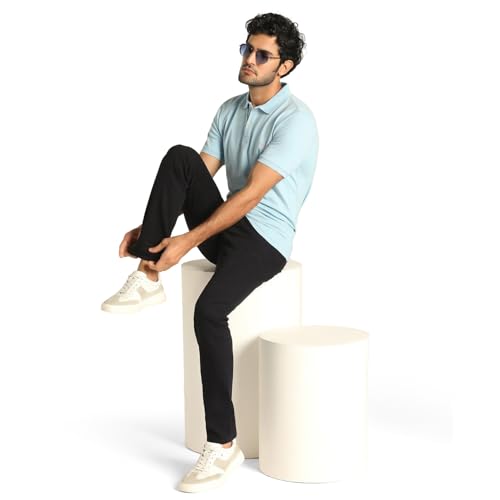 Blackberry Men Yonk Fit stretchable skinny jeans in navy, size 34, displayed on a hanger with visible denim fabric and stitching details.