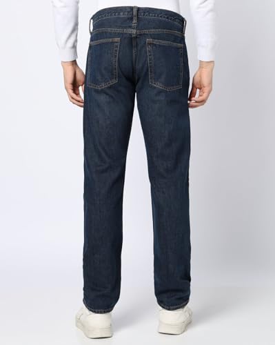 Men's dark washed straight fit stretchable jeans by Gap, mid-rise style, showing front view with pockets and belt loops.