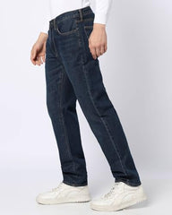 Men's dark washed straight fit stretchable jeans by Gap, mid-rise design with classic denim texture and subtle fading.