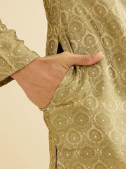 Manyavar men's green brocade kurta set with self-design pattern, paired with matching pajama, traditional ethnic attire for men.