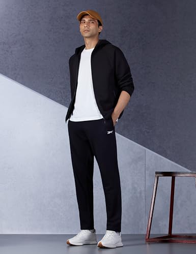 Reebok men's black Dash pants, sportswear pajama style, with elastic waistband and comfortable fit, suitable for athletic wear or lounge.