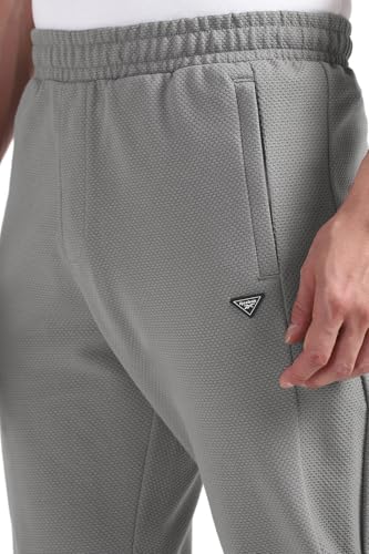 Reebok men's grey sportswear pajama pants with elastic waistband and relaxed fit for comfortable casual wear.