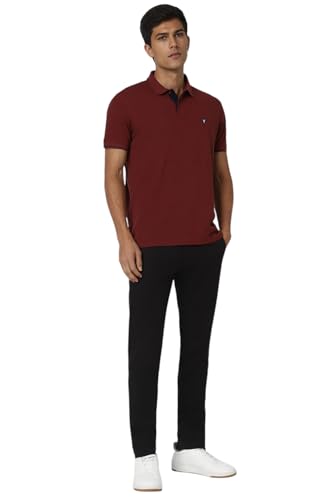 White Van Heusen men's long sleeve T-shirt displayed on a hanger, showcasing a classic fit and smooth fabric texture.