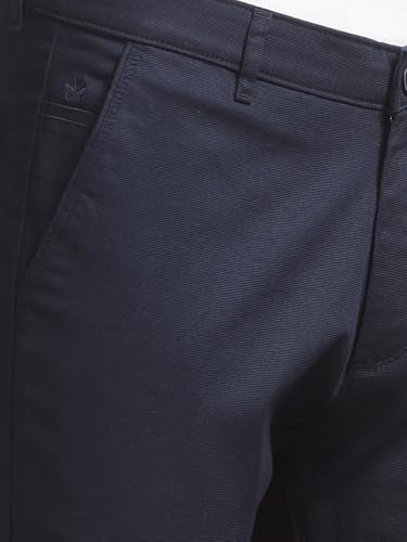 Navy blue men's casual trousers by Crimsoune Club, showing the relaxed fit and fabric texture.