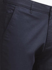 Navy blue men's casual trousers by Crimsoune Club, showing the relaxed fit and fabric texture.