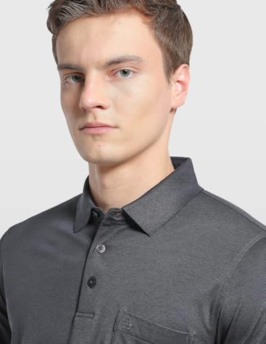 Arrow men's solid regular fit polo shirt in a classic style, displayed on a mannequin, with a collared neckline and short sleeves.