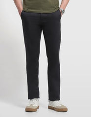 Arrow Sport men's solid Bronson slim fit casual trousers, dark fabric, front pockets, and tailored waistband.