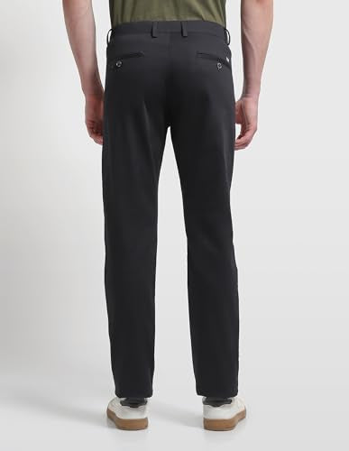 Arrow Sport men's solid Bronson slim fit casual trousers, shown in a dark fabric, with a flat front and tailored fit.