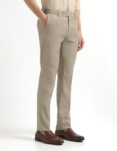 Arrow men's textured formal trousers in regular fit, displayed on a hanger with visible waistband and tailored details.