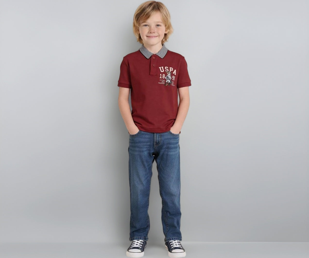 U.S. Polo Kids boys' red graphic printed regular fit polo shirt for ages 13-14, with short sleeves and collar.