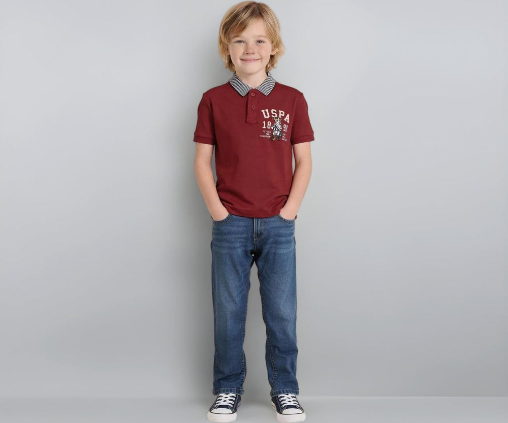 U.S. Polo Kids boys' red graphic printed regular fit polo shirt for ages 13-14, with short sleeves and collar.