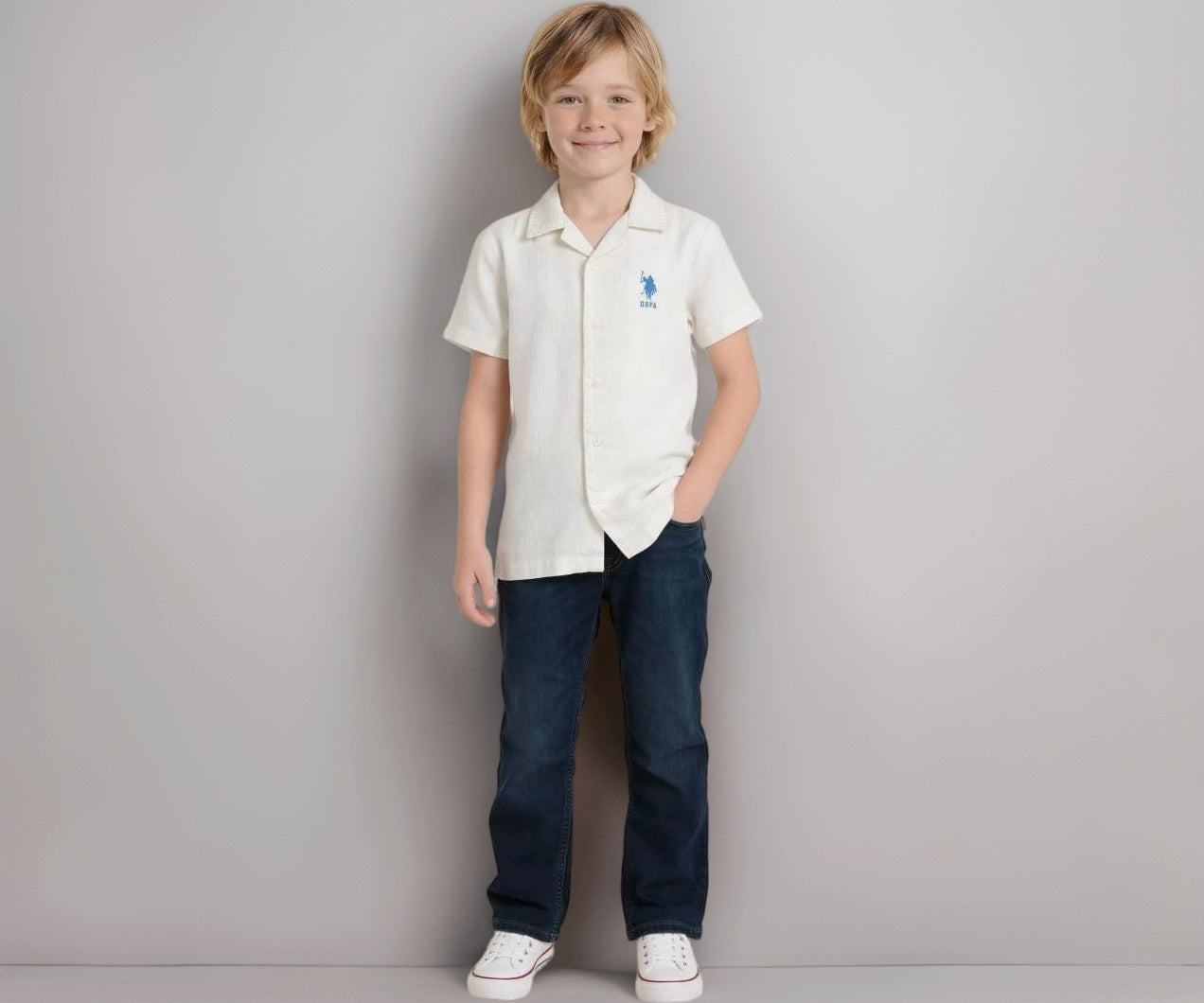 U.S.Polo Kids boys white textured graphic appliqued shirt for ages 11-12, featuring a colorful brand logo and comfortable fit.