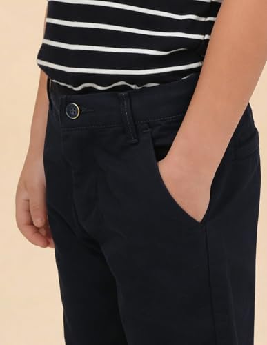 U.S. Polo boys navy cargo pants for kids, featuring multiple pockets and a comfortable fit, displayed on a hanger.