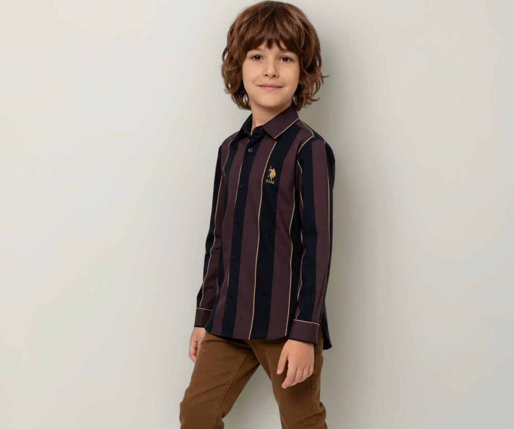 U.S. Polo Kids boys vertical striped regular fit shirt with long sleeves, classic collar, and button closure.