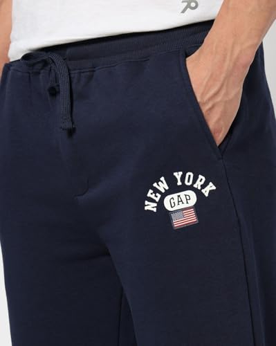 Navy blue Gap men's regular fit mid-rise joggers with elastic waistband and cuffed ankles, casual sportswear for men.