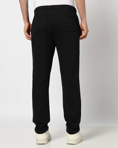 Men's Gap logo print mid-rise track pants with sportswear fit, featuring a comfortable waistband and casual style.