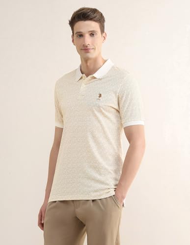 U.S. Polo Association men's tropical printed slim fit polo shirt with short sleeves and vibrant tropical pattern.