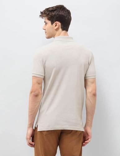 U.S. Polo Assn. Denim Co. men's beige graphic printed muscle fit polo shirt with short sleeves and brand logo design.