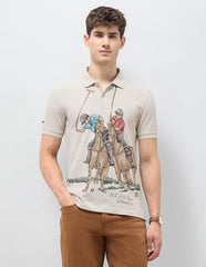 U.S. Polo Assn. Denim Co. men's beige graphic printed muscle fit polo shirt with short sleeves and bold brand design.
