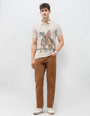 U.S. Polo Assn. Denim Co. men's beige graphic printed muscle fit polo shirt, short sleeve, casual style, front view.
