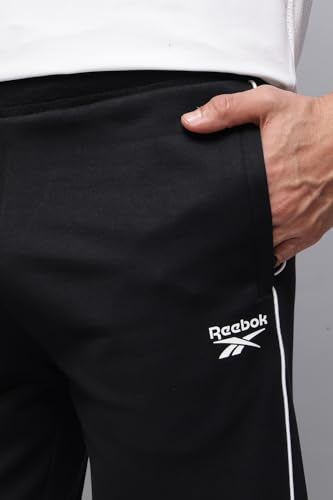 Reebok men's winter tracksuit in black with white accents, full zip jacket and matching pants, casual athletic winterwear.