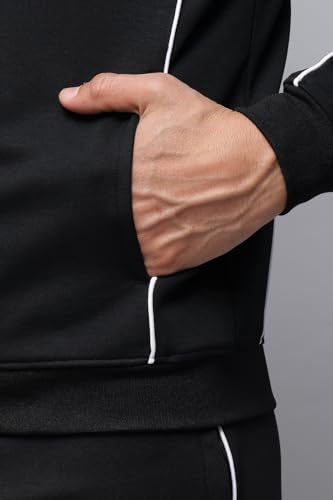 Reebok men's winter tracksuit featuring a zip-up jacket and matching pants, designed for active wear and cold weather comfort.