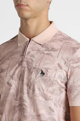 Men's pink printed polo neck T-shirt by Van Heusen, showcasing a stylish short-sleeve design with vibrant print details.
