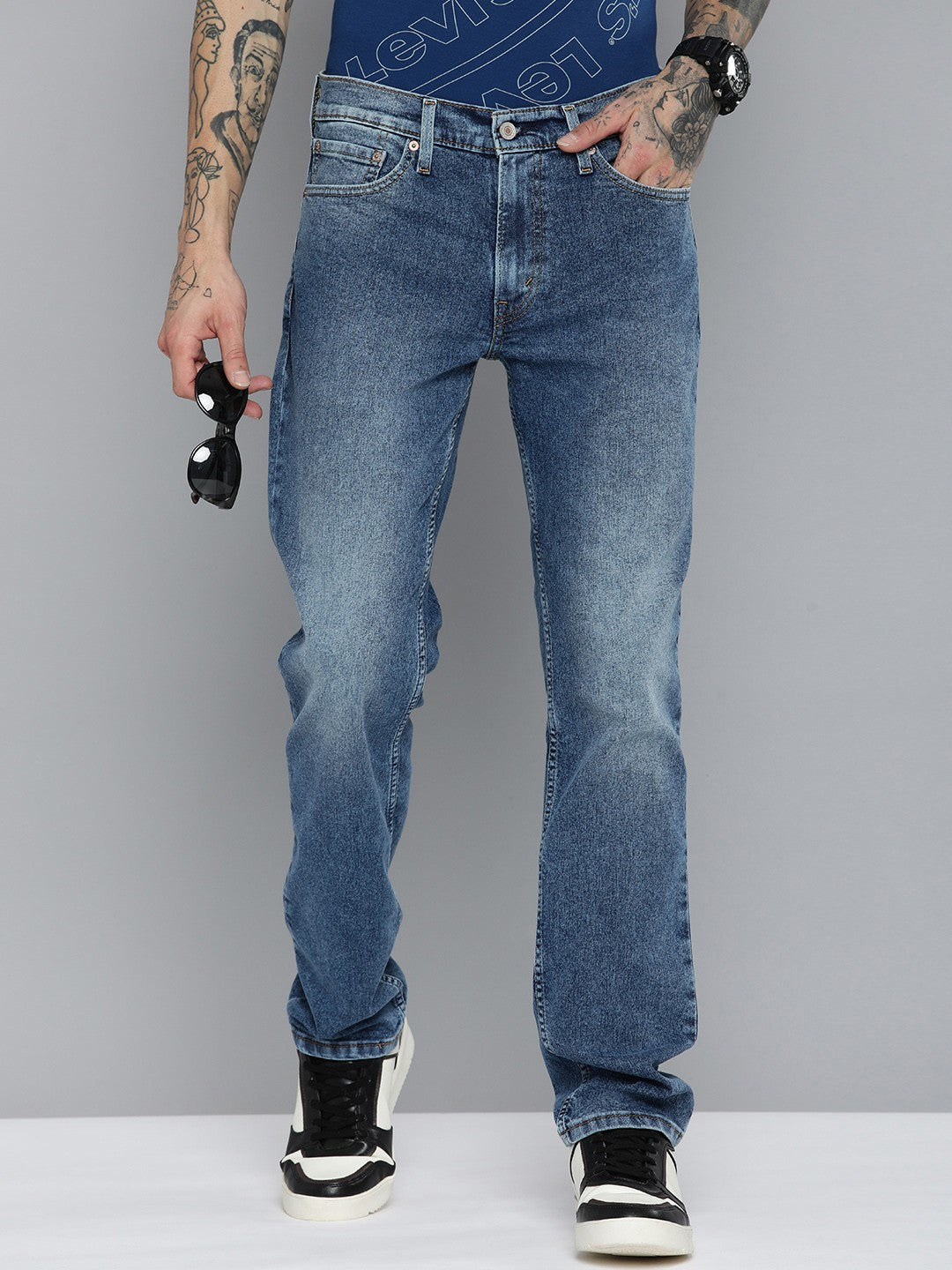 Levi's men's 511 blue slim fit mid-rise jeans, showing front view with classic five-pocket design and tapered leg style.