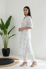 Aurelia ladies Western kurti in a vibrant design, featuring intricate patterns and a stylish fit, shown on a mannequin.