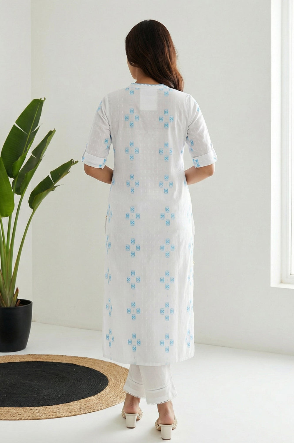 Aurelia ladies western kurti in vibrant fabric, displayed on a hanger with intricate design details and bright colors.