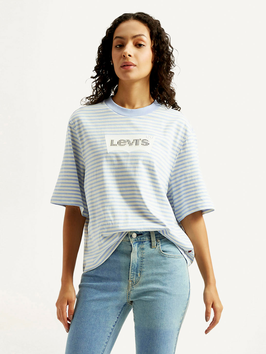 Levi's women's striped relaxed fit T-shirt, casual western top with horizontal stripes, displayed on a model.