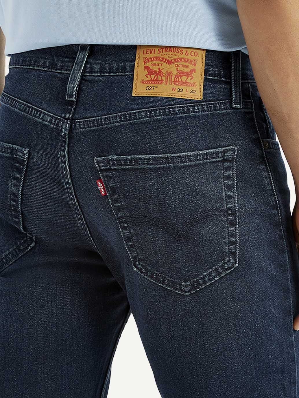 Close-up of Levi's men's jeans showing denim texture and stitching details, style A6634-0065 in a natural pose.