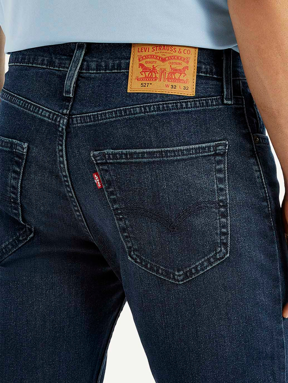 Close-up of Levi's men's jeans showing denim texture and stitching details, style A6634-0065 in a natural pose.