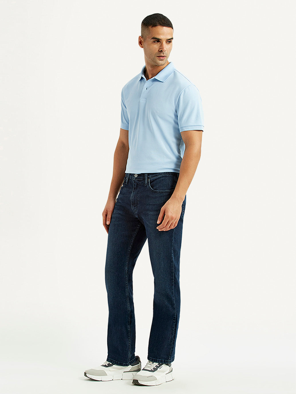 Levis men's jeans A6634-0065 in dark wash, side view showing classic fit and stitching details.