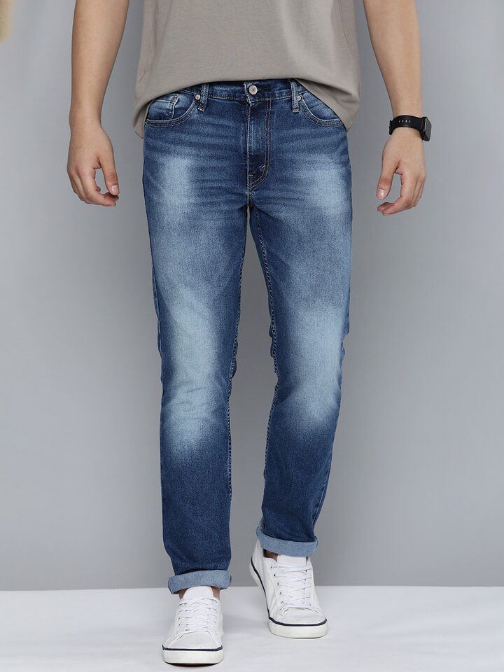Front view of Levi's men's jeans A7710-0015, classic fit denim pants for men, showing the front pockets and button closure.