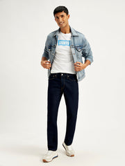 Levi's men's 511 blue slim fit mid-rise jeans displayed on a model in a style shot.