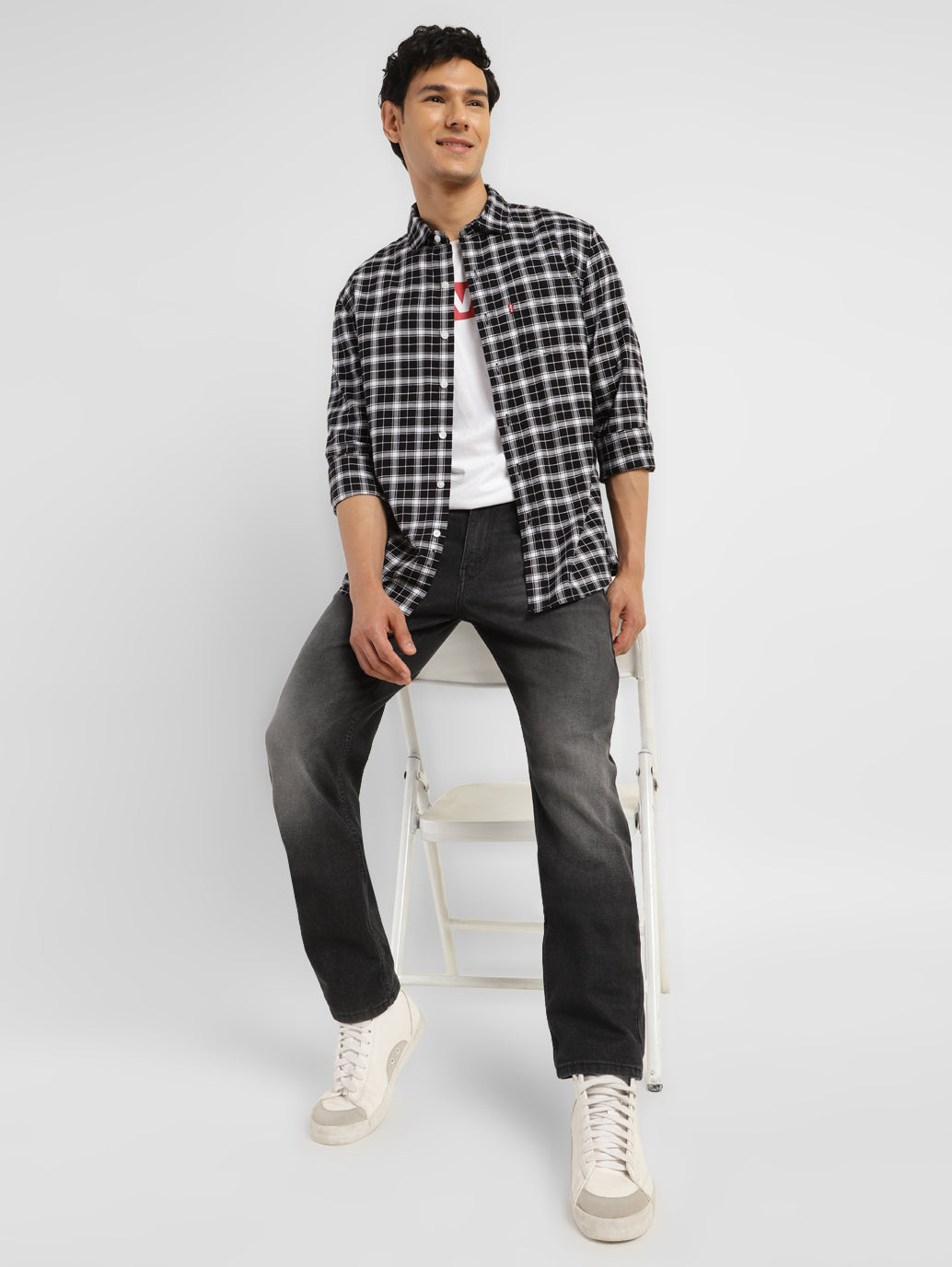 Levis men's jeans A7710-0019 in classic denim, shown in a style shot highlighting fit and stitching details.